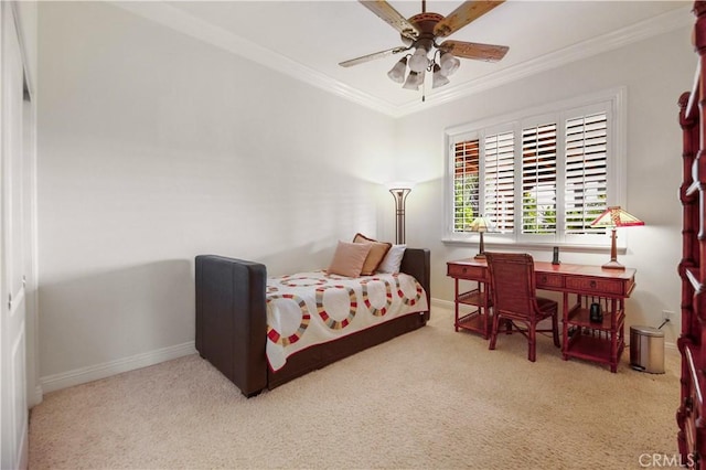 bedroom with carpet flooring, baseboards, ornamental molding, and ceiling fan