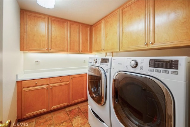 laundry room featuring washer and dryer and cabinet space