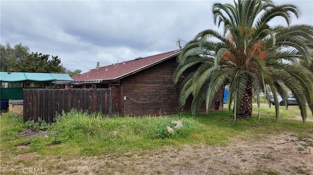 view of property exterior with fence
