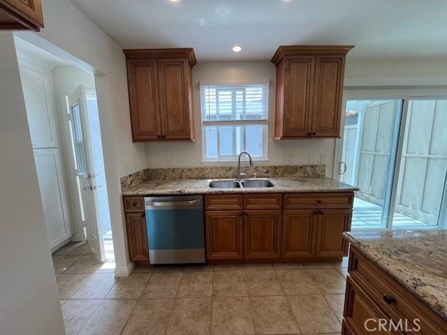 14675 Red Hill Ave, Tustin, CA 92780 - kitchen with a sink, brown cabinetry, light stone countertops, and dishwasher