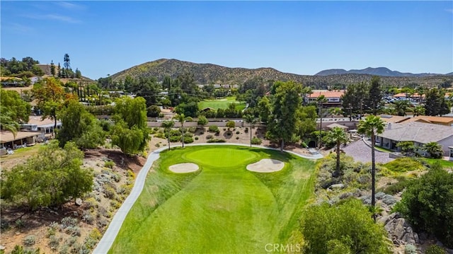 aerial view featuring a residential view, a mountain view, and view of golf course