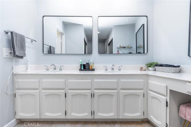 full bathroom featuring double vanity and a sink