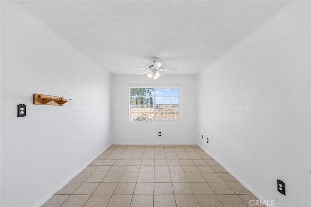 unfurnished room with baseboards and a ceiling fan