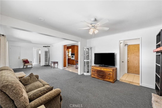 living room with carpet flooring and ceiling fan