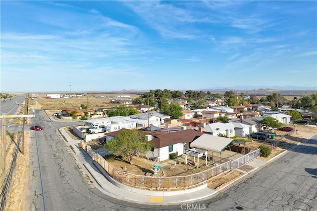 drone / aerial view featuring a residential view and a mountain view