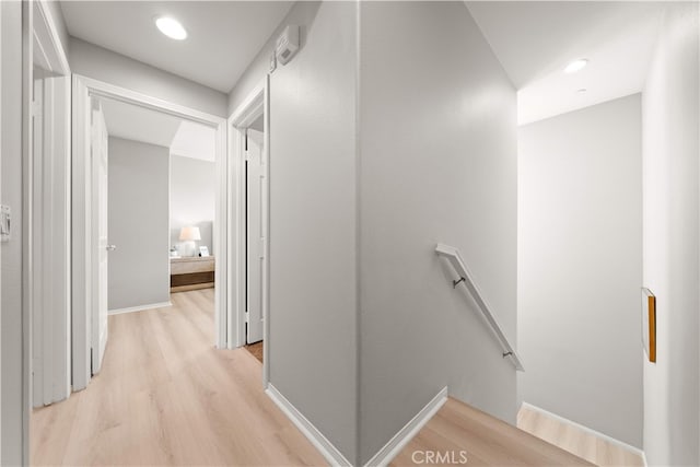 15212 Cambridge St, Tustin, CA 92782 - corridor with light wood-type flooring and an upstairs landing