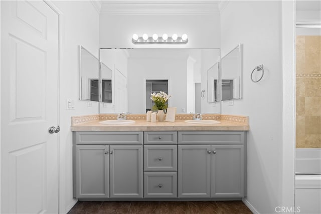 15212 Cambridge St, Tustin, CA 92782 - full bath with crown molding, double vanity, a sink, and a bathtub