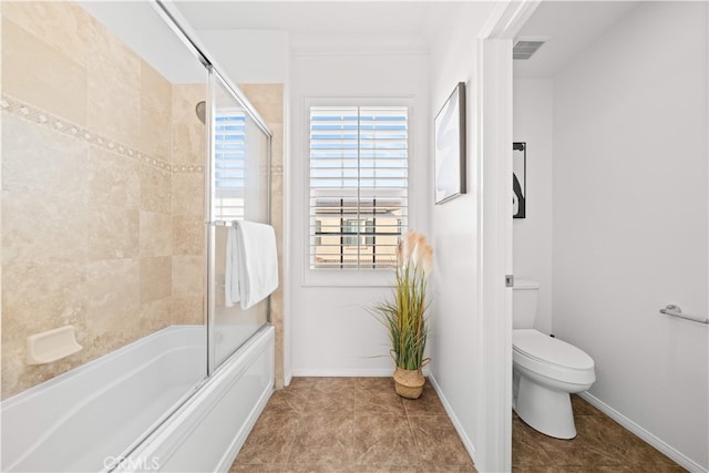 15212 Cambridge St, Tustin, CA 92782 - bathroom with baseboards, toilet, shower / bath combination with glass door, and visible vents