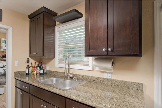 15709 Devonshire St, Granada Hills, CA 91344 - kitchen with a sink and dark brown cabinetry