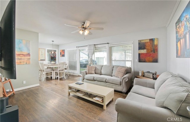 15709 Devonshire St, Granada Hills, CA 91344 - living area with ceiling fan, baseboards, dark wood-style flooring, and a chandelier
