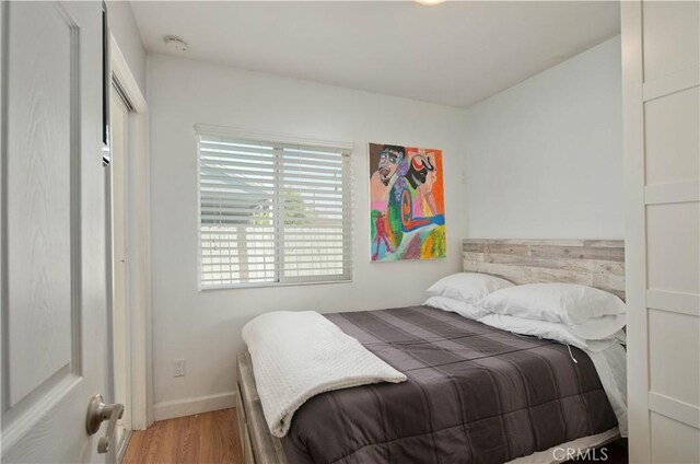 15709 Devonshire St, Granada Hills, CA 91344 - bedroom featuring wood finished floors