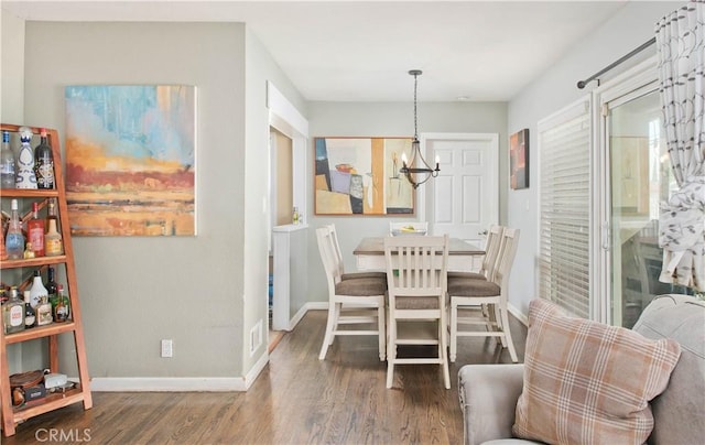 15709 Devonshire St, Granada Hills, CA 91344 - dining space with wood finished floors, baseboards, and a chandelier