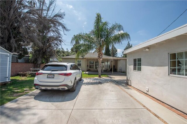 15709 Devonshire St, Granada Hills, CA 91344 - view of front of home with stucco siding, fence, and crawl space