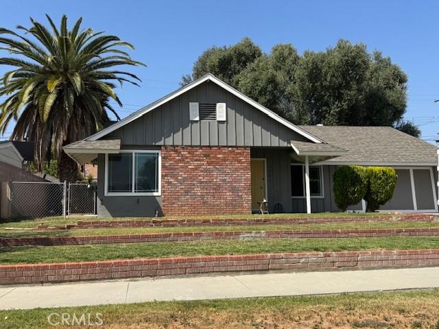5945 Crystal Hill St, Riverside, CA 92504 - view of front of house featuring board and batten siding and brick siding