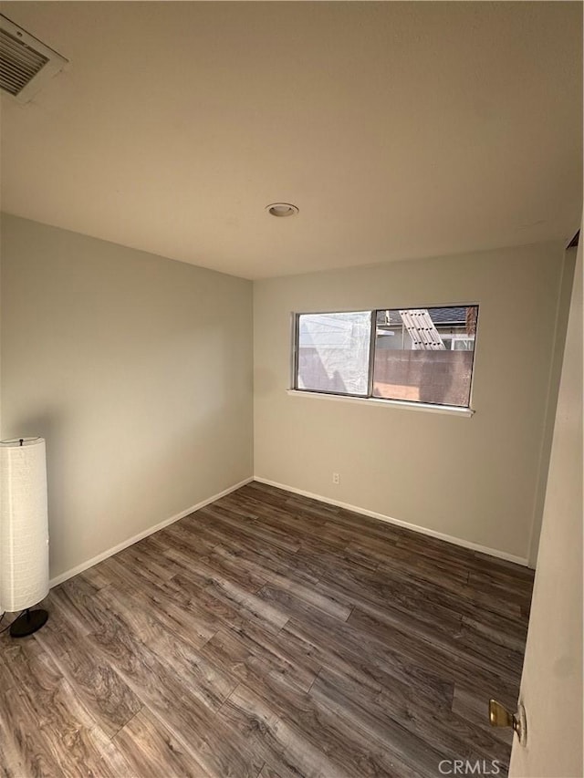 5945 Crystal Hill St, Riverside, CA 92504 - unfurnished room with dark wood-type flooring and baseboards