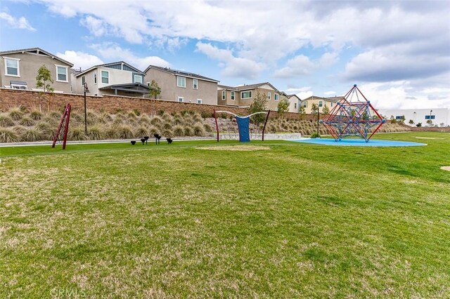 5597 Royal Oaks Way, Fontana, CA 92336 - view of green lawn with a residential view