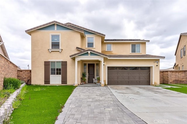 5597 Royal Oaks Way, Fontana, CA 92336 - traditional-style home featuring stucco siding, an attached garage, concrete driveway, and roof mounted solar panels