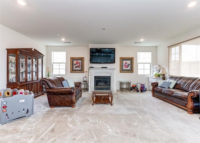 5597 Royal Oaks Way, Fontana, CA 92336 - carpeted living room featuring recessed lighting and a glass covered fireplace