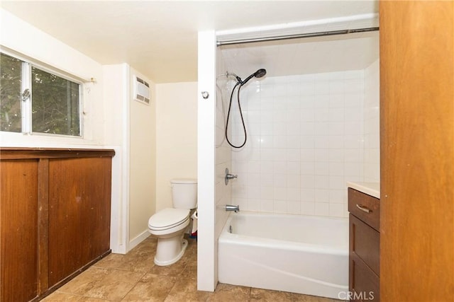 full bath featuring vanity, tile patterned floors, toilet, and  shower combination