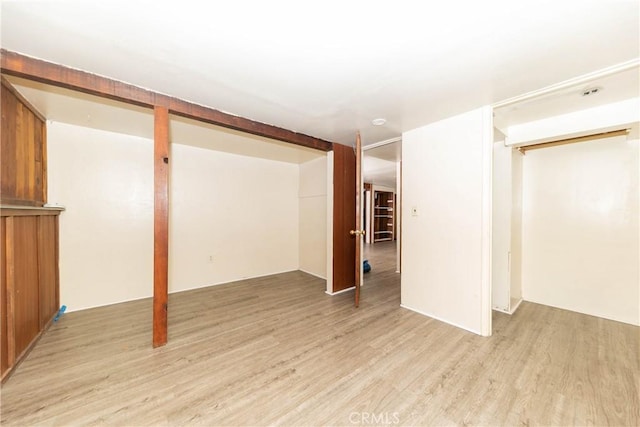 finished below grade area featuring light wood-type flooring
