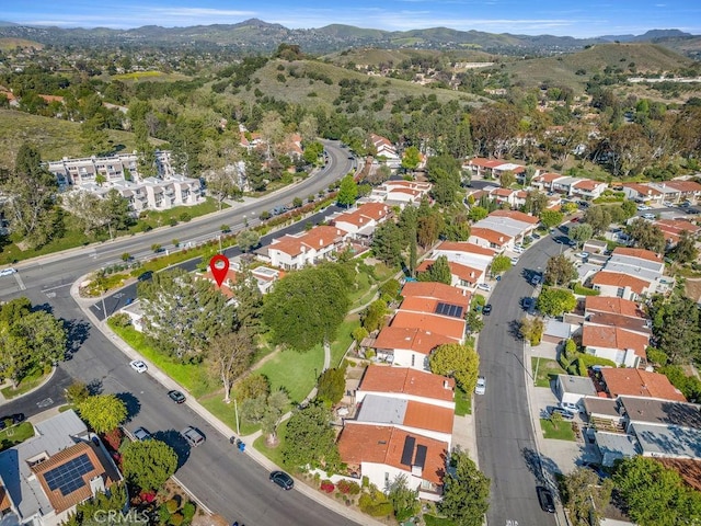birds eye view of property with a residential view and a mountain view