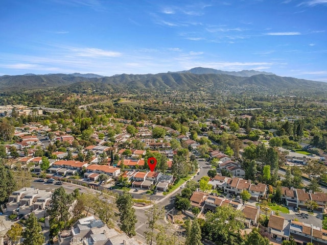 birds eye view of property with a mountain view and a residential view