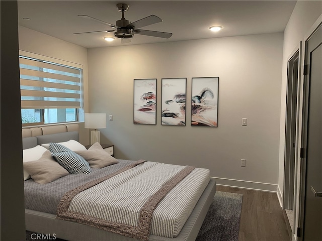 bedroom with baseboards, ceiling fan, recessed lighting, and wood finished floors