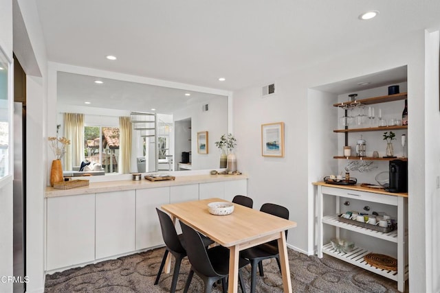 dining room featuring carpet floors, recessed lighting, and visible vents