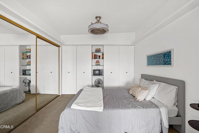 carpeted bedroom featuring a closet