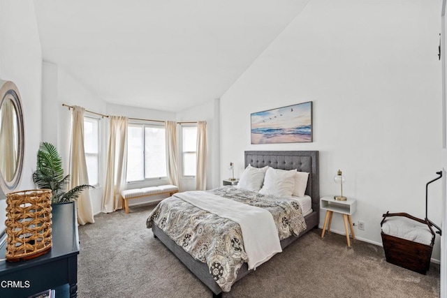 carpeted bedroom with lofted ceiling
