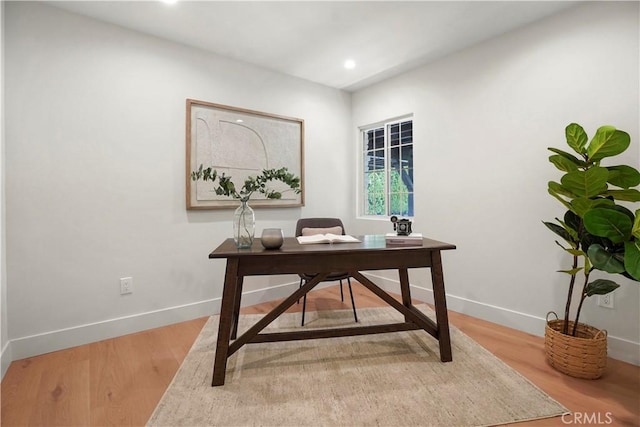 office featuring recessed lighting, baseboards, and light wood-style flooring