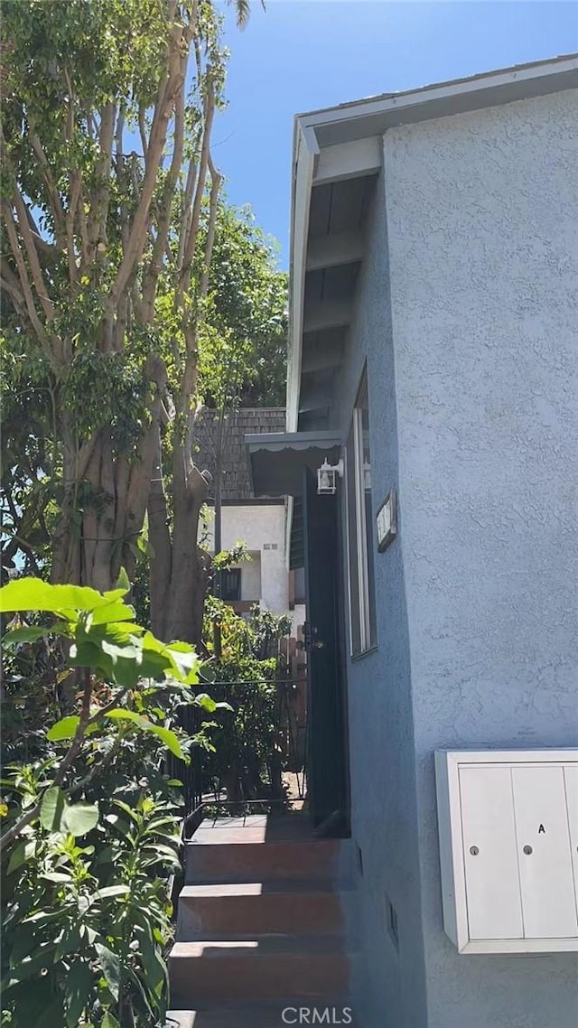 exterior space featuring stucco siding