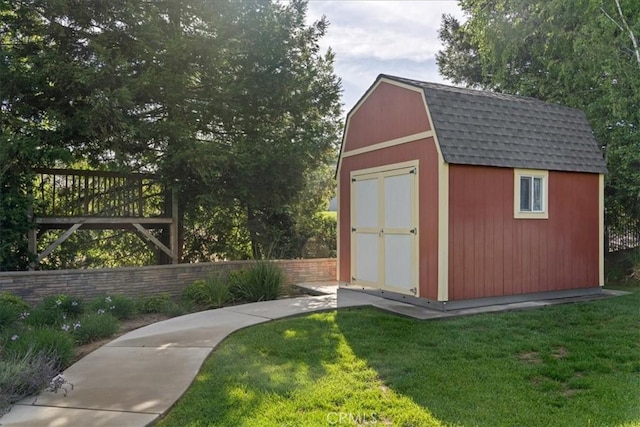 view of shed with fence