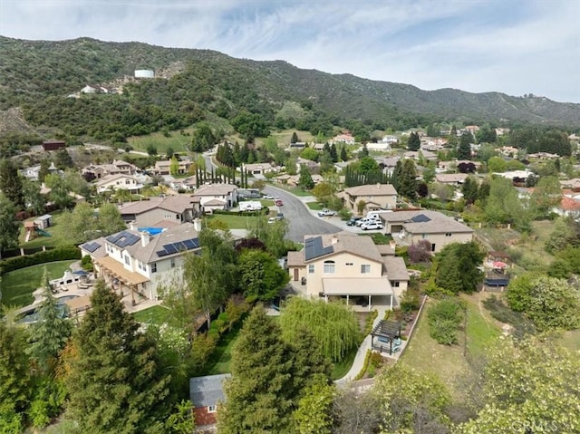 birds eye view of property featuring a mountain view and a residential view