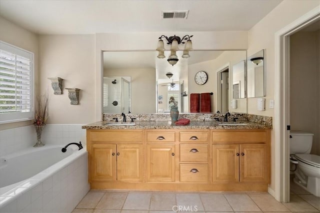 full bath with toilet, tile patterned floors, visible vents, and a sink