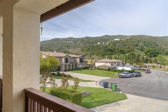 balcony with a mountain view and a residential view