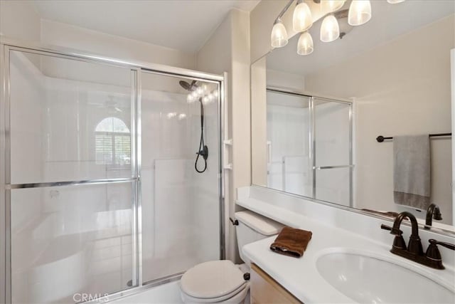 full bath with an enclosed shower, toilet, and vanity