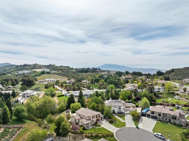 drone / aerial view with a residential view and a mountain view