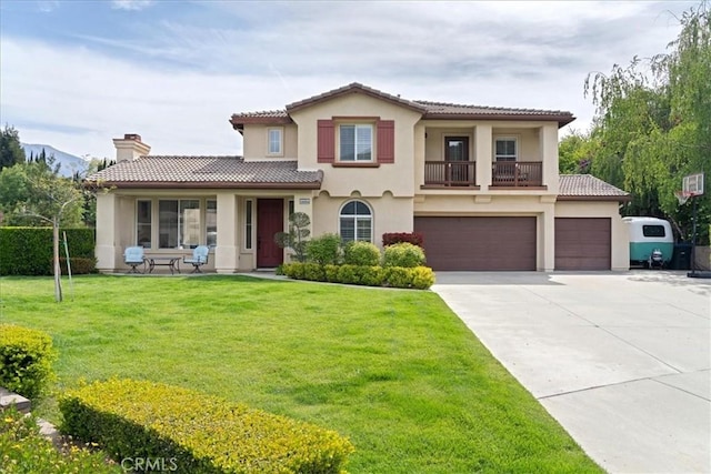 view of front of home with a tiled roof, concrete driveway, a balcony, and stucco siding