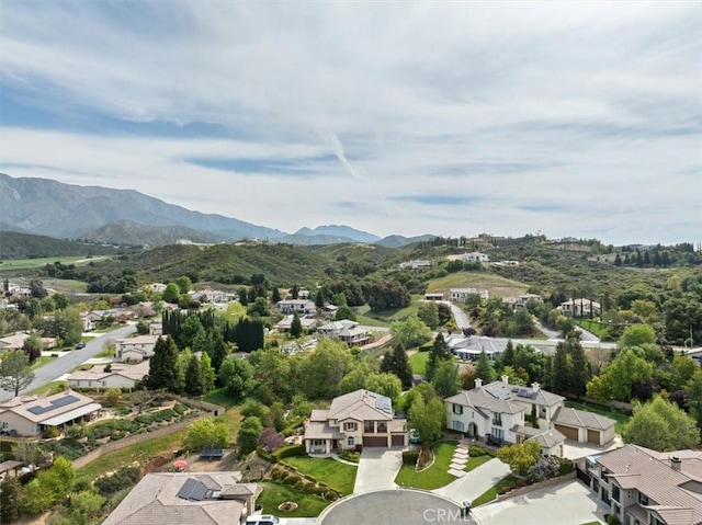 aerial view featuring a mountain view and a residential view