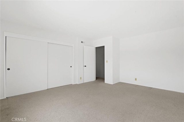 unfurnished bedroom featuring a closet