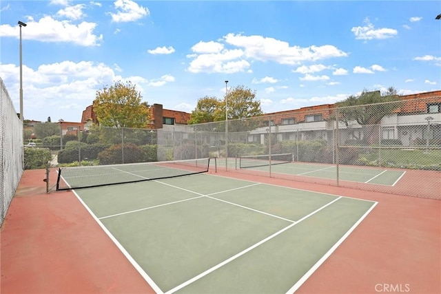 view of sport court featuring fence and community basketball court