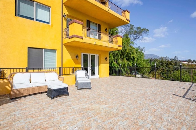 9336 Wayside Dr, Sunland, CA 91040 - view of patio featuring fence, a mountain view, an outdoor living space, a balcony, and french doors