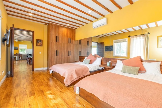 9336 Wayside Dr, Sunland, CA 91040 - bedroom featuring light wood-style floors, baseboards, a wall unit AC, and recessed lighting