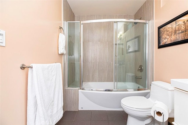 9336 Wayside Dr, Sunland, CA 91040 - full bath with bath / shower combo with glass door, tile patterned floors, and toilet