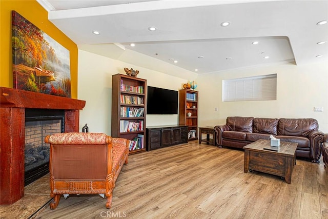 9336 Wayside Dr, Sunland, CA 91040 - living room featuring recessed lighting, a raised ceiling, wood finished floors, and a fireplace