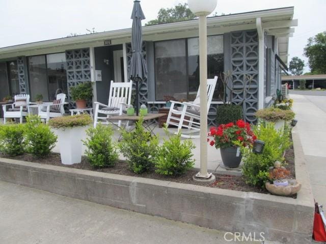 13730 Annandale Dr Unit M1-30G, Seal Beach, CA 90740 - rear view of property with covered porch