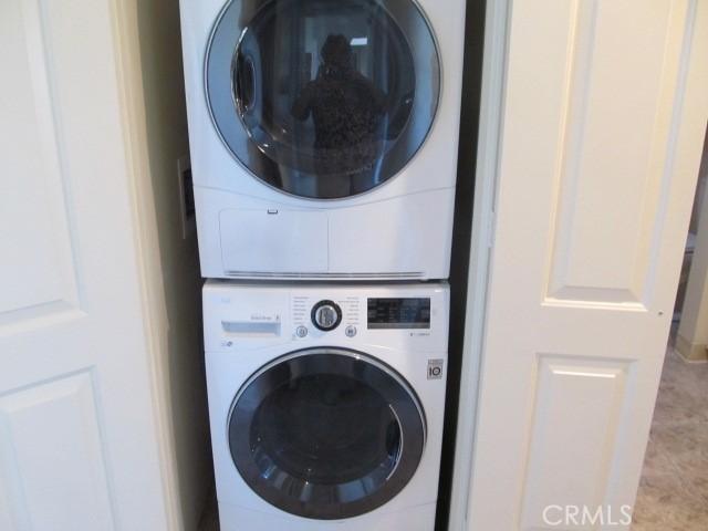 13730 Annandale Dr Unit M1-30G, Seal Beach, CA 90740 - laundry room featuring laundry area and stacked washer / dryer