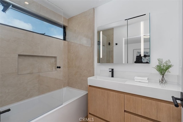 bathroom with vanity and bath / shower combo with glass door