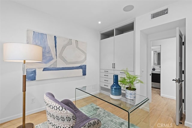home office featuring recessed lighting, baseboards, visible vents, and light wood finished floors